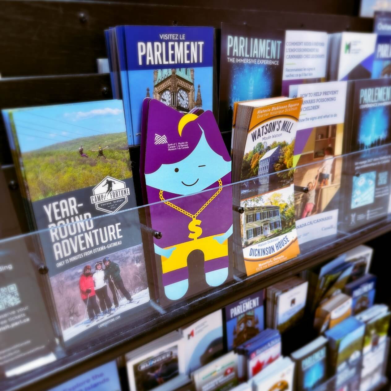 Brochure created by Alphabet® as it looks compared in a stand with other brochures.